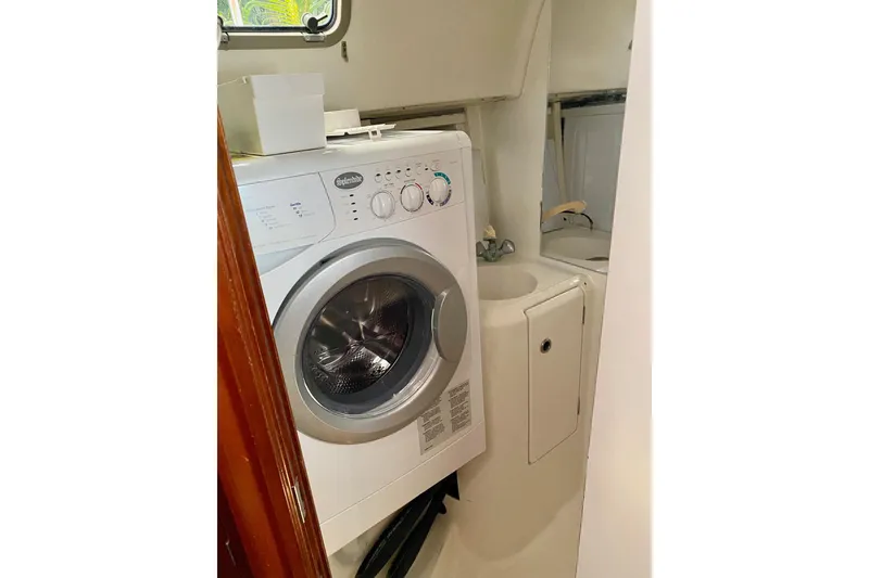Slide: The Image of Laundry area with washer in 1997 Beneteau Oceanis 461 yacht bathroom. - 44