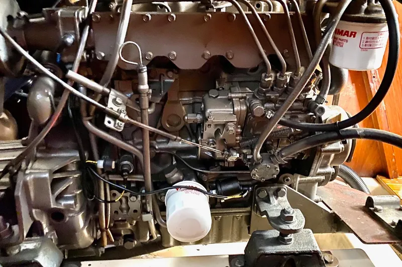 Slide: The Image of Engine of a 1997 Beneteau Oceanis 461 sailboat, showcasing intricate mechanical components. - 45