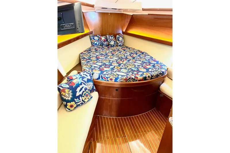 Slide: The Image of Cozy cabin interior of 1997 Beneteau Oceanis 461 with floral bedding and wood finish. - 47