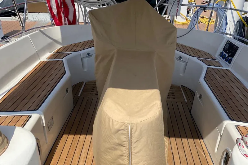 Slide: The Image of Cockpit of 1997 Beneteau Oceanis 461 sailboat with teak flooring and covered helm. - 58