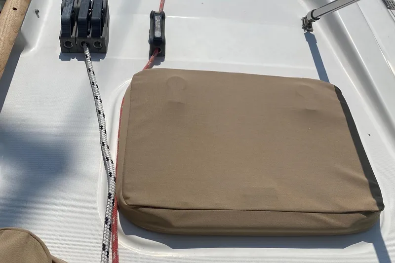 Slide: The Image of Deck of 1997 Beneteau Oceanis 461 sailboat with cushion and rigging ropes. - 61