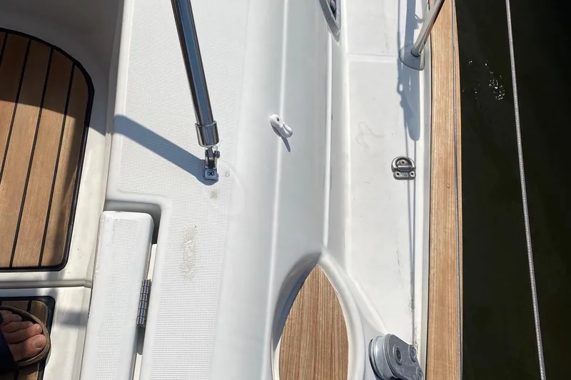 Slide: The Image of Deck view of 1997 Beneteau Oceanis 461 sailboat with teak and white fiberglass details. - 62