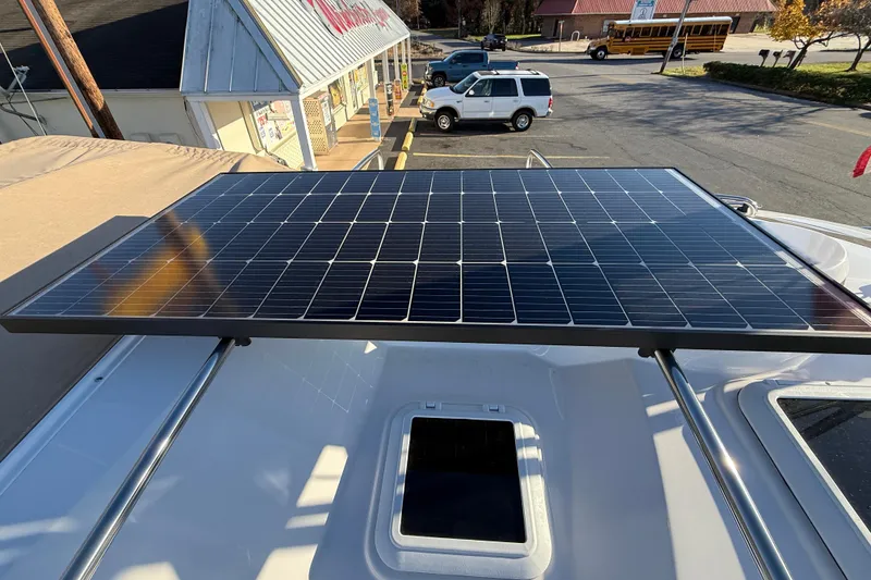 Slide: The Image of Solar panel on 2026 Ranger Tugs R-23 boat roof in parking lot setting. - 25