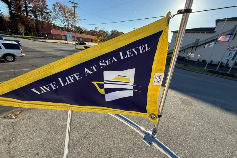 Slide: The Image of Flag on Ranger Tugs R-23, 2026, with "Live Life At Sea Level" slogan. - 26