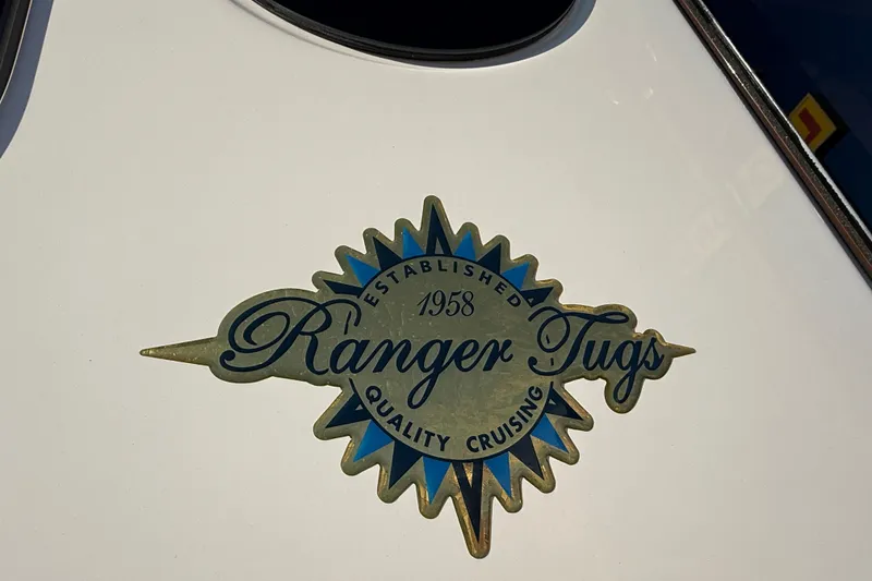 Slide: The Image of Ranger Tugs emblem on 2026 R-23 boat, highlighting quality cruising since 1958. - 29