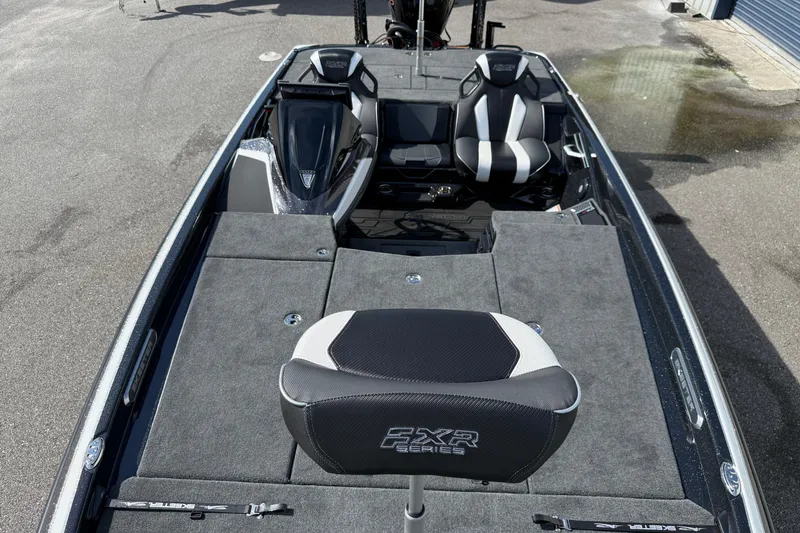 Slide: The Image of 2026 Skeeter FXR21 FLEX boat interior with seating and deck view. - 13
