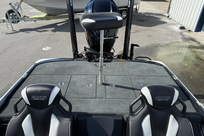 Slide: The Image of 2026 Skeeter FXR21 FLEX boat interior with dual seats and motor view. - 18