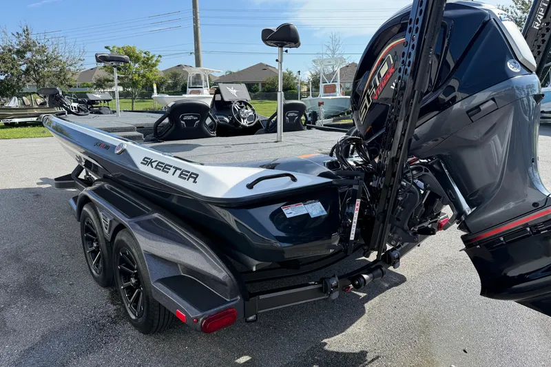 Slide: The Image of 2026 Skeeter FXR21 FLEX boat with powerful outboard motor on a trailer. - 20