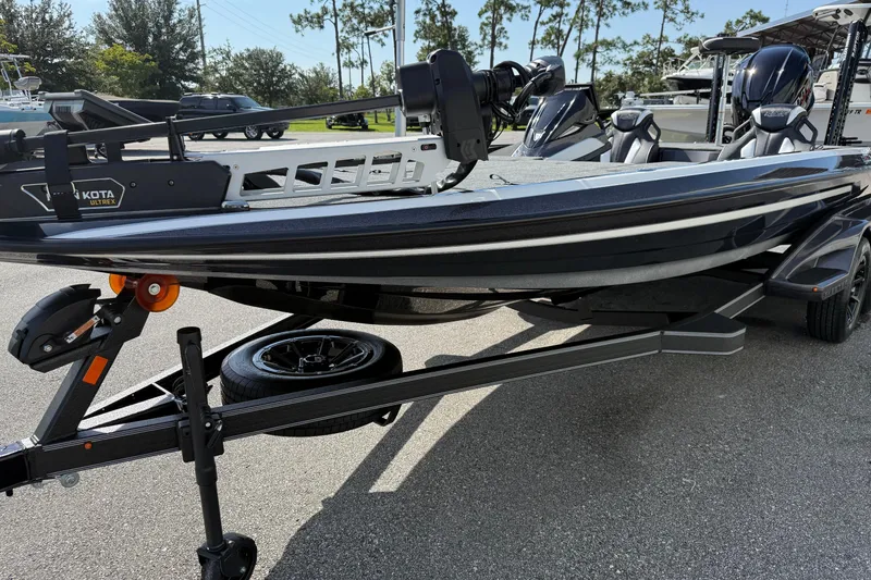 Slide: The Image of 2026 Skeeter FXR21 FLEX boat on trailer, featuring Minn Kota Ultrex motor. - 3
