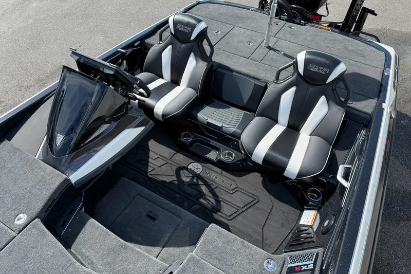 Slide: The Image of 2026 Skeeter FXR21 FLEX boat interior with dual seats and modern dashboard. - 6