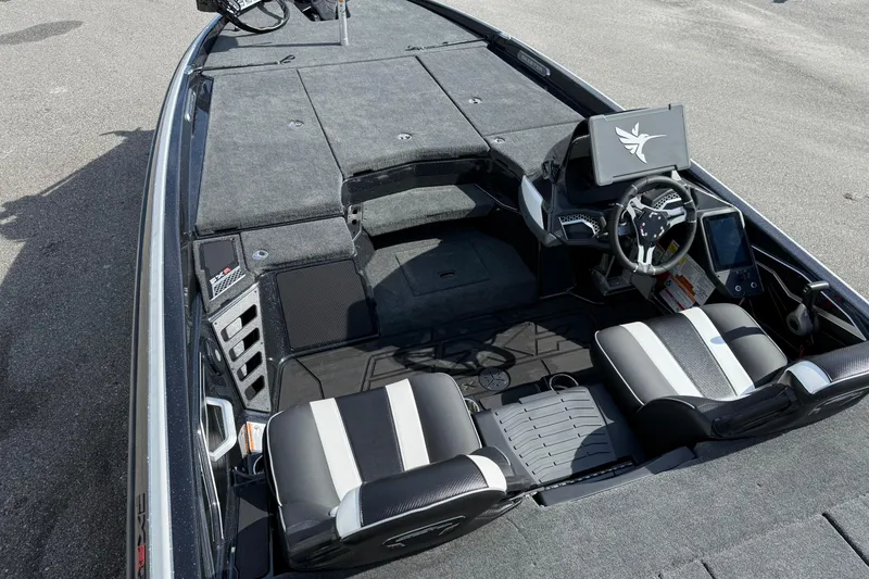 Slide: The Image of 2026 Skeeter FXR21 FLEX boat interior with dual seats and modern dashboard. - 7