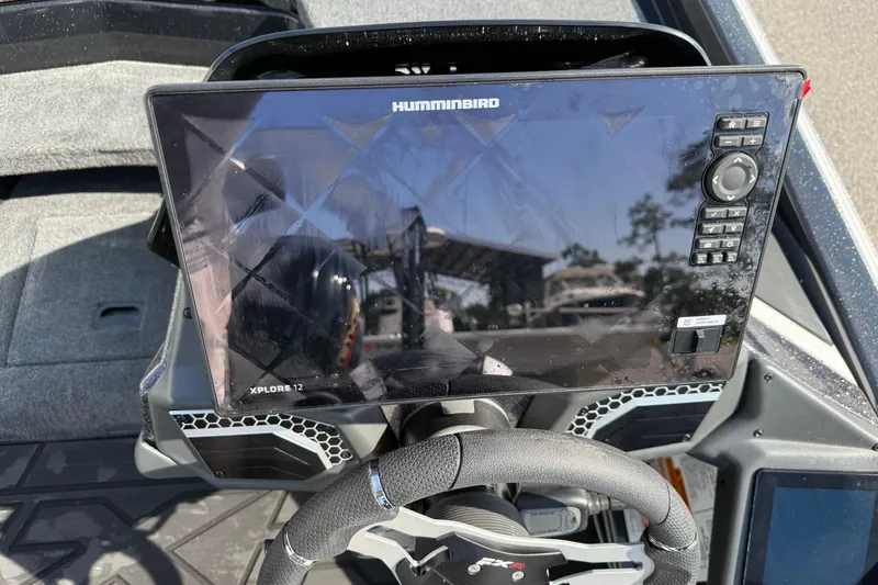 Slide: The Image of 2026 Skeeter FXR21 FLEX boat dashboard with Humminbird Xplore 12 display. - 9