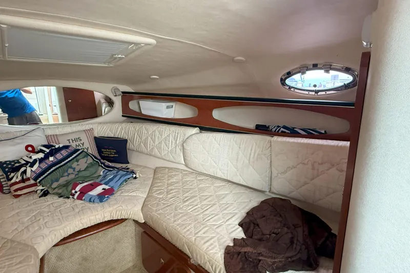 Slide: The Image of Interior cabin of 2003 Sea Ray 260 Sundancer with cozy seating and decorative pillows. - 20