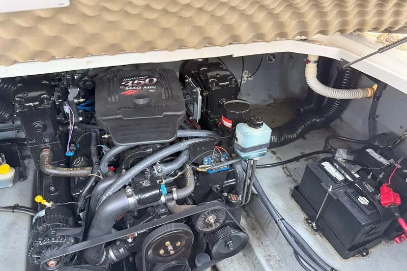 Slide: The Image of Engine compartment of a 2003 Sea Ray 260 Sundancer with MerCruiser 350 MAG MPI engine. - 24