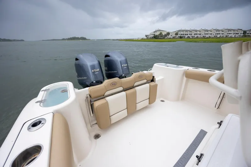 Slide: The Image of 2017 Key West 244 Center Console boat with twin engines on a cloudy day. - 10