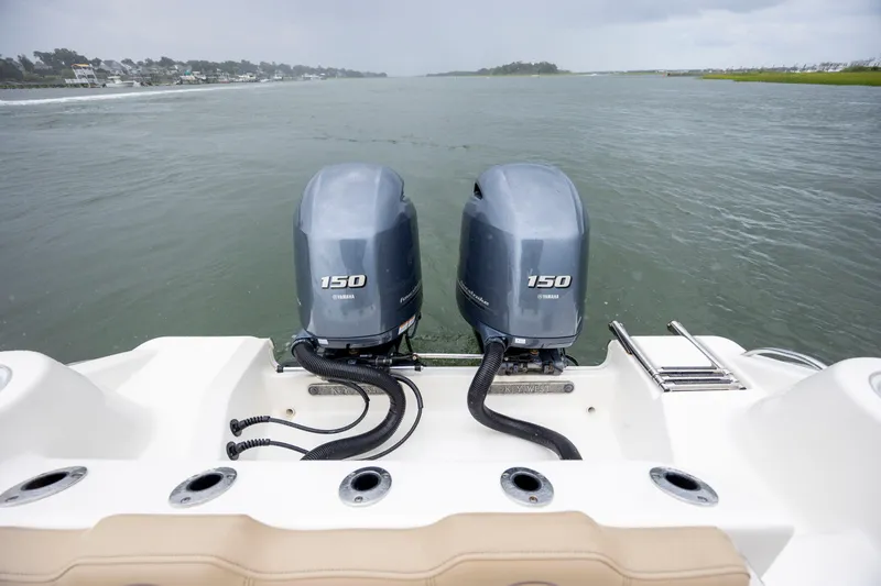 Slide: The Image of 2017 Key West 244 Center Console with dual Yamaha 150 engines on open water. - 11