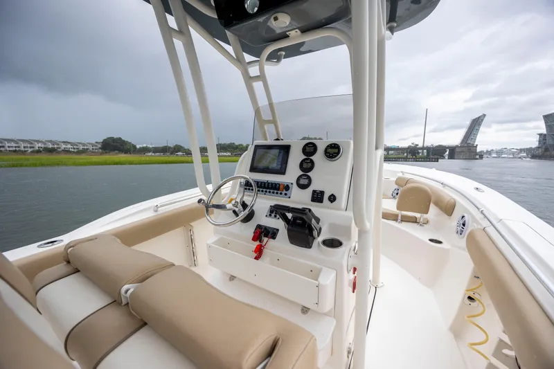 Slide: The Image of 2017 Key West 244 Center Console boat interior with steering wheel and control panel. - 15