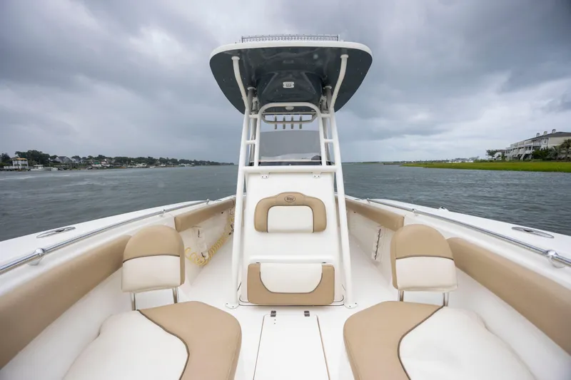 Slide: The Image of 2017 Key West 244 Center Console boat on water under cloudy sky. - 19
