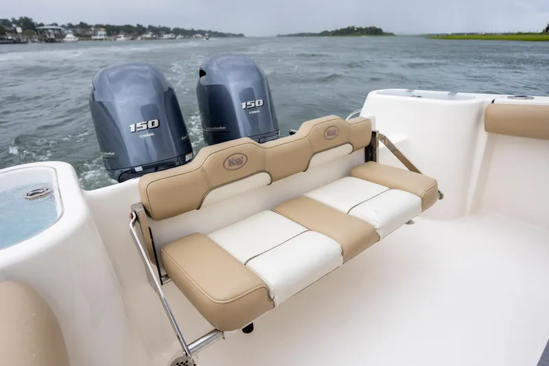 Slide: The Image of 2017 Key West 244 Center Console boat with twin Yamaha 150 engines on water. - 22