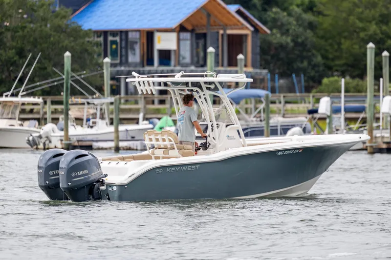 Slide: The Image of 2017 Key West 244 Center Console boat with dual Yamaha engines on the water. - 7
