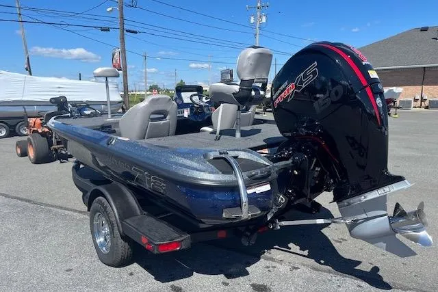 Slide: The Image of 2026 Nitro Z18 Pro fishing boat with powerful outboard motor, parked on a trailer. - 8
