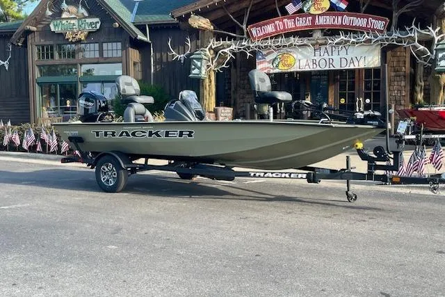 The Image of 2026 Tracker Pro Team 175 boat parked outdoors, featuring a sleek design and modern seating. - 0