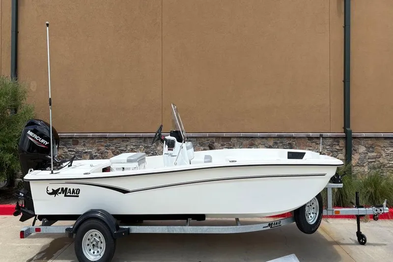 Slide: The Image of 2026 Mako Pro Skiff 17 CC boat on trailer, side view. - 2