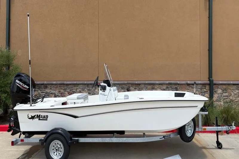 Slide: The Image of 2026 Mako Pro Skiff 17 CC boat on trailer, side view, outdoors. - 51