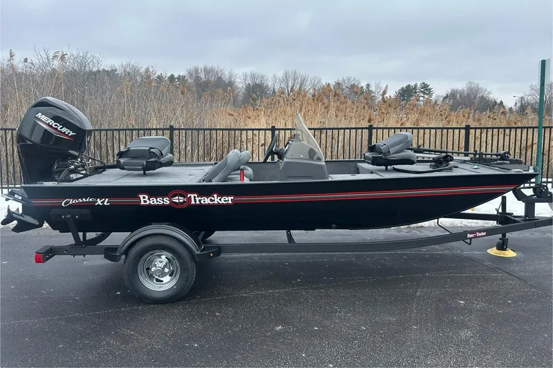 The Image of 2026 Tracker Bass Tracker Classic XL boat on trailer, parked outdoors. - 0