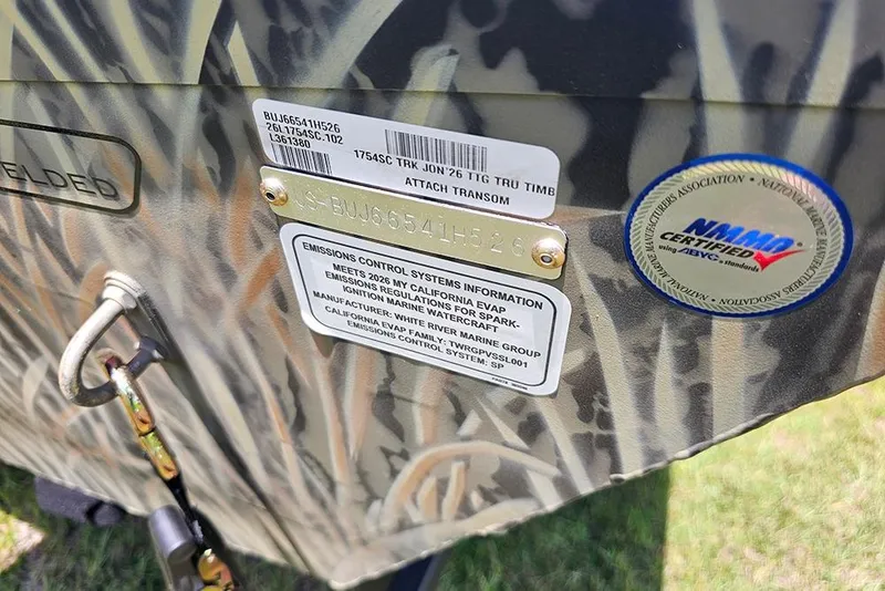 Slide: The Image of 2026 Tracker Grizzly 1754 SC boat with certification and emissions information labels. - 15