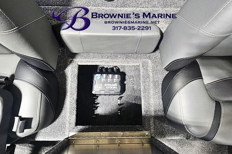Slide: The Image of Interior of 2026 Tracker Pro Team 190 boat with electronic device between seats. - 12