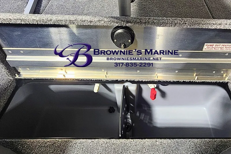 Slide: The Image of 2026 Tracker Pro Team 190 boat compartment with Brownie's Marine branding. - 14