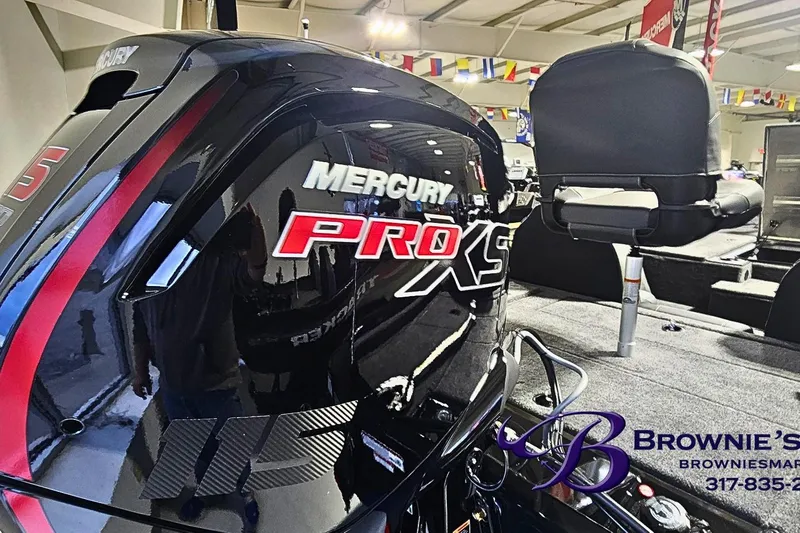 Slide: The Image of 2026 Tracker Pro Team 190 boat with Mercury Pro XS engine in showroom. - 15