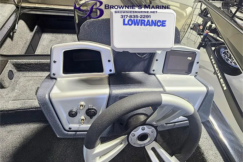 Slide: The Image of 2026 Tracker Pro Team 190 boat dashboard with steering wheel and electronic displays. - 9