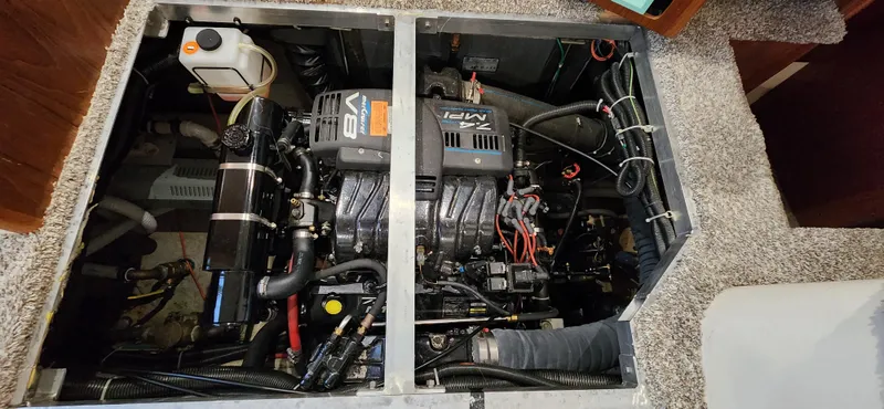 Slide: The Image of 1998 Carver 355 Aft Cabin Motor Yacht engine compartment with V8 engine and components. - 29