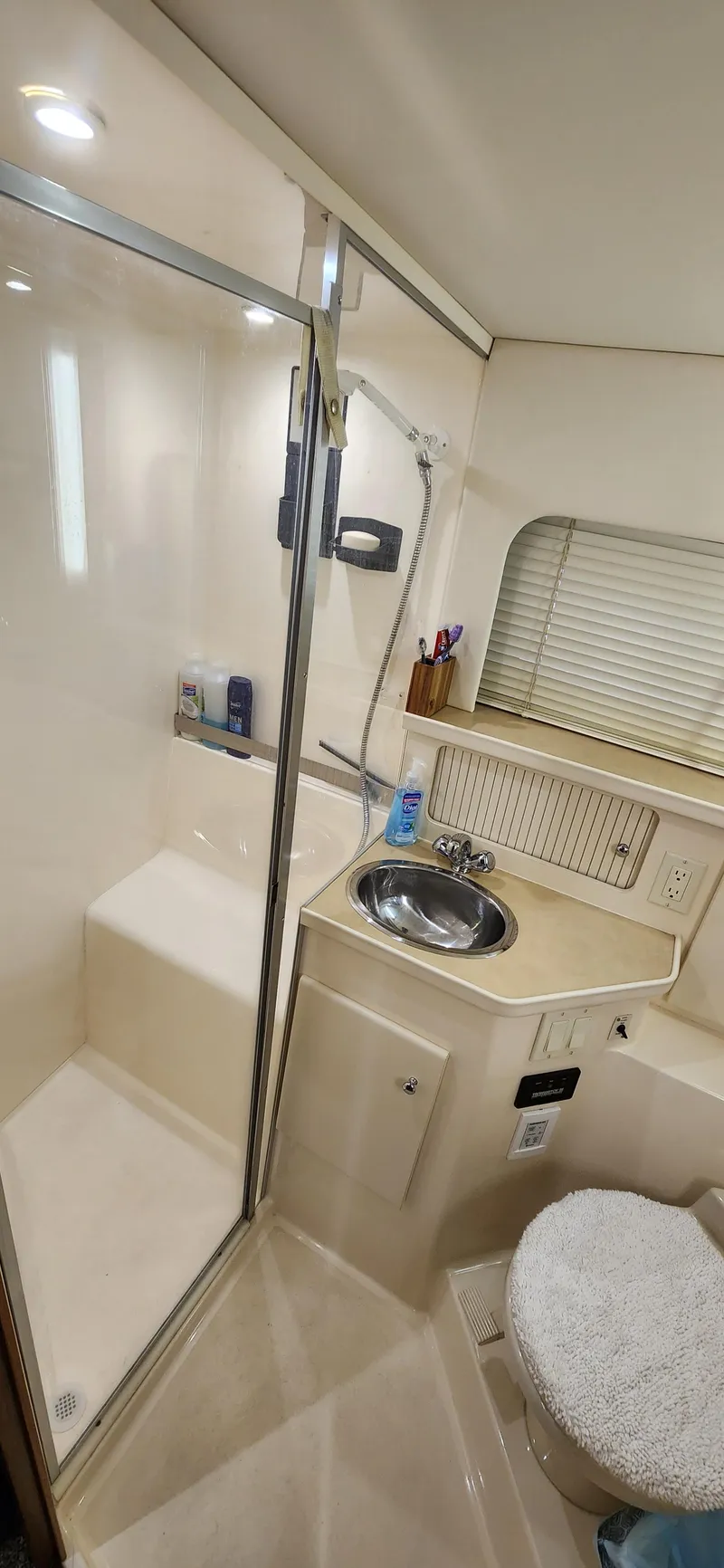 Slide: The Image of 1998 Carver 355 Aft Cabin Motor Yacht bathroom with shower and sink. - 28