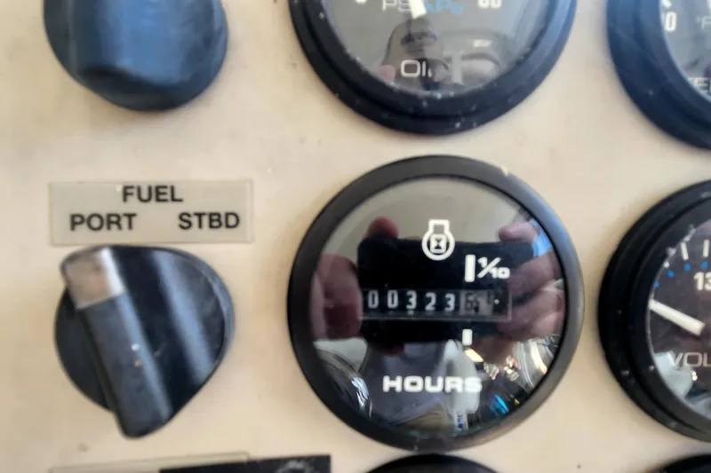 Slide: The Image of 1998 Carver 355 Aft Cabin dashboard with fuel gauge and hour meter reading 3236. - 41