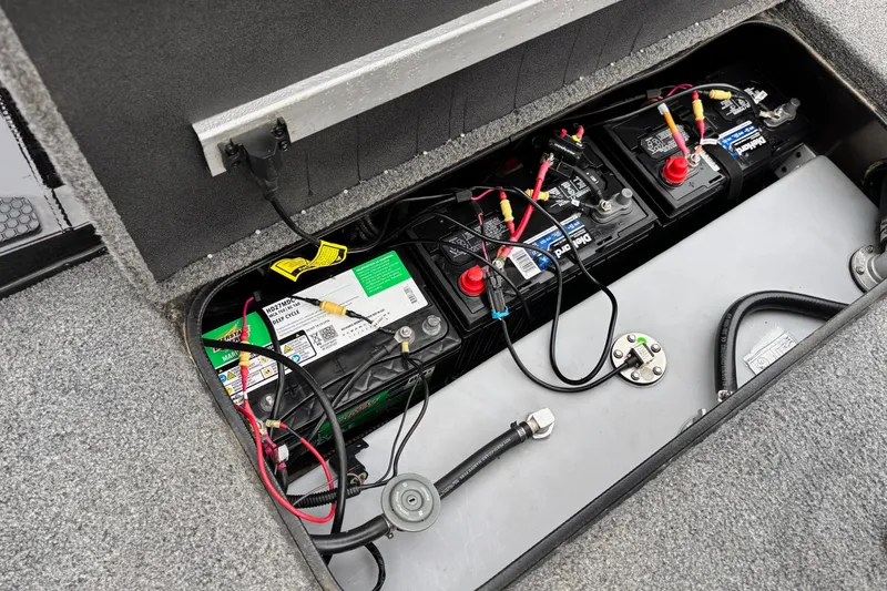 Slide: The Image of 2023 Ranger RT178 boat battery compartment with multiple connected batteries. - 11