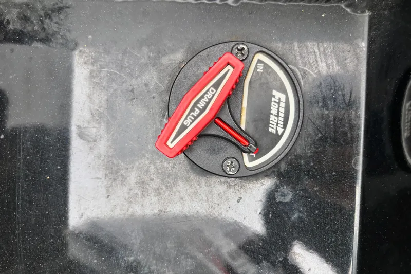 Slide: The Image of 2023 Ranger RT178 Flow-Rite drain plug on black surface. - 12