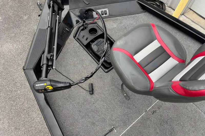 Slide: The Image of 2023 Ranger RT178 boat interior with trolling motor and red-gray seat. - 3