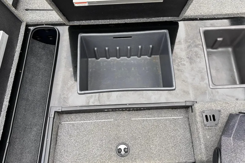 Slide: The Image of 2023 Ranger RT178 boat storage compartments with textured flooring. - 5