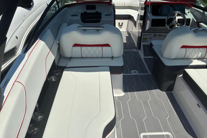 Slide: The Image of 2022 Regal LX2 boat interior with white seating and modern dashboard design. - 10