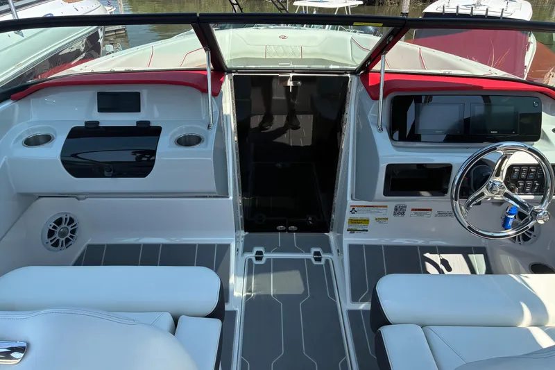 Slide: The Image of 2022 Regal LX2 boat interior with modern dashboard and steering wheel. - 14