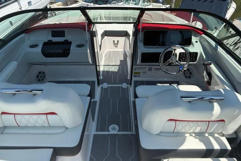 Slide: The Image of 2022 Regal LX2 boat interior with modern dashboard and seating. - 9