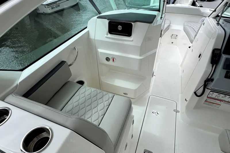 Slide: The Image of 2026 Pursuit DC 266 Dual Console interior with seating and console details. - 15
