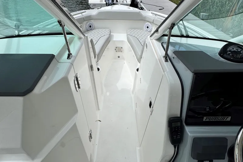 Slide: The Image of 2026 Pursuit DC 266 Dual Console interior with sleek seating and modern dashboard. - 17