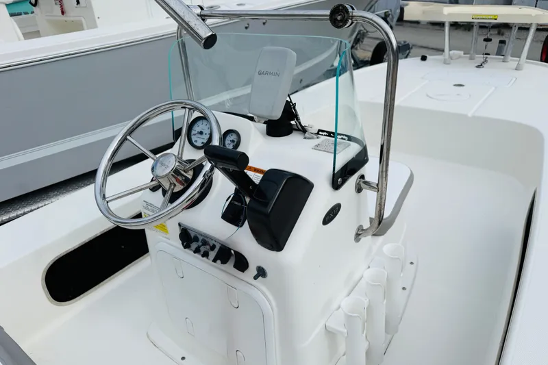 Slide: The Image of 2014 Spyder FX17 boat console with steering wheel and Garmin navigation system. - 9