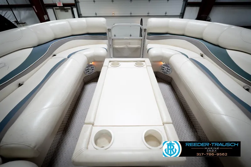 Slide: The Image of Interior of a 2006 Bennington 2250RL pontoon boat with white seating and table. - 20