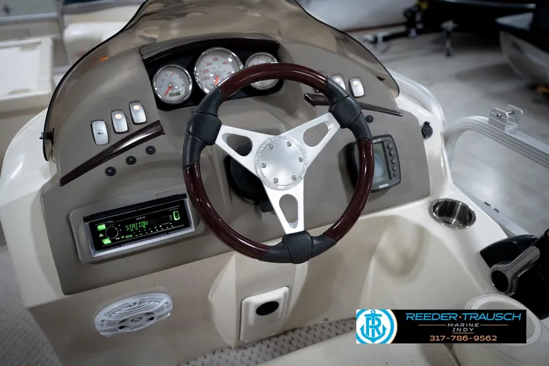 Slide: The Image of Steering console of a 2006 Bennington 2250RL boat with gauges and controls. - 29