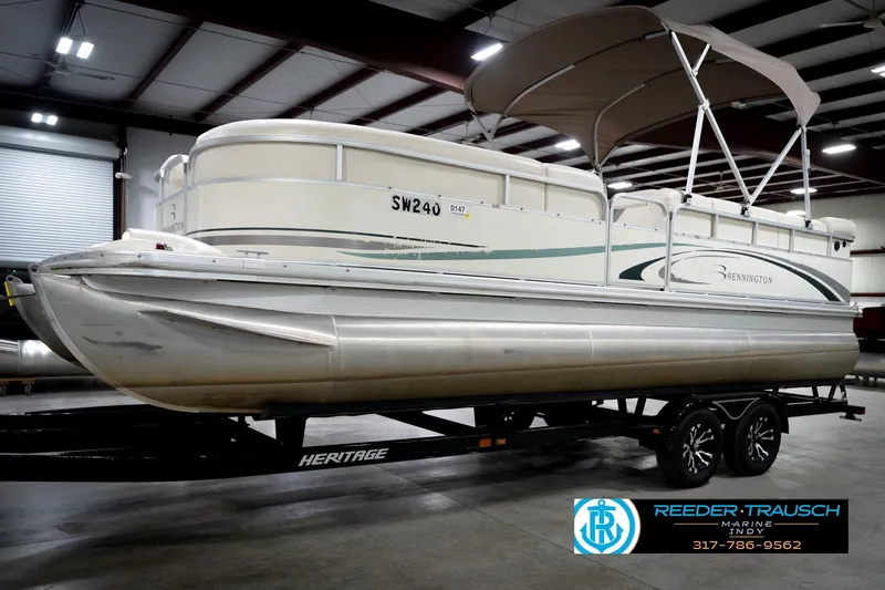 Slide: The Image of 2006 Bennington 2250RL pontoon boat on trailer in indoor showroom. - 3